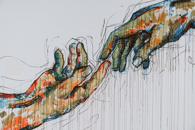 Image of two hands reaching out to each other